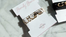 Load and play video in Gallery viewer, Bendy-Band: Foiled Gold Snakeskin (White)
